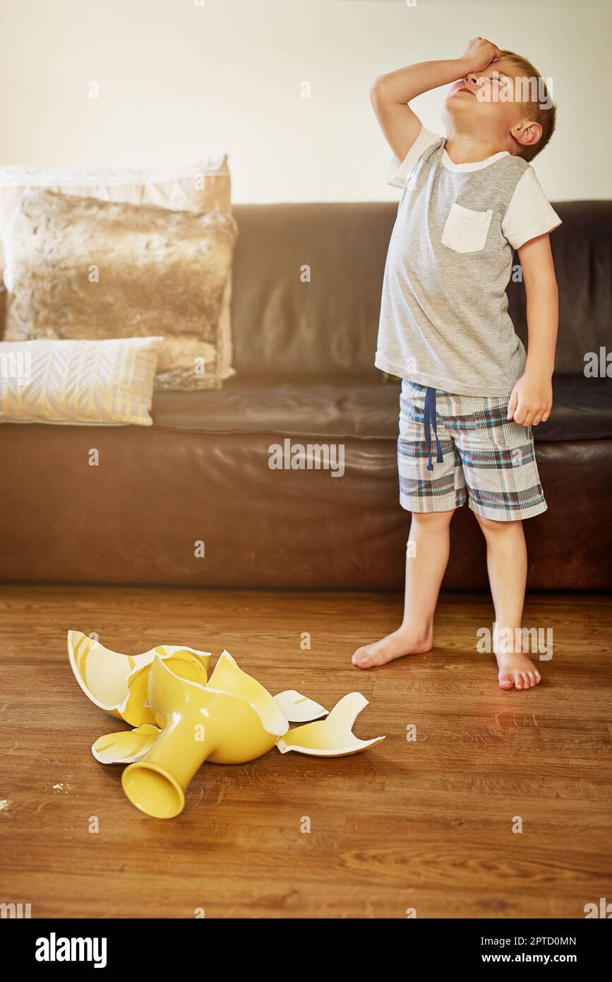 Boy with broken vase hires stock photography and images Alamy