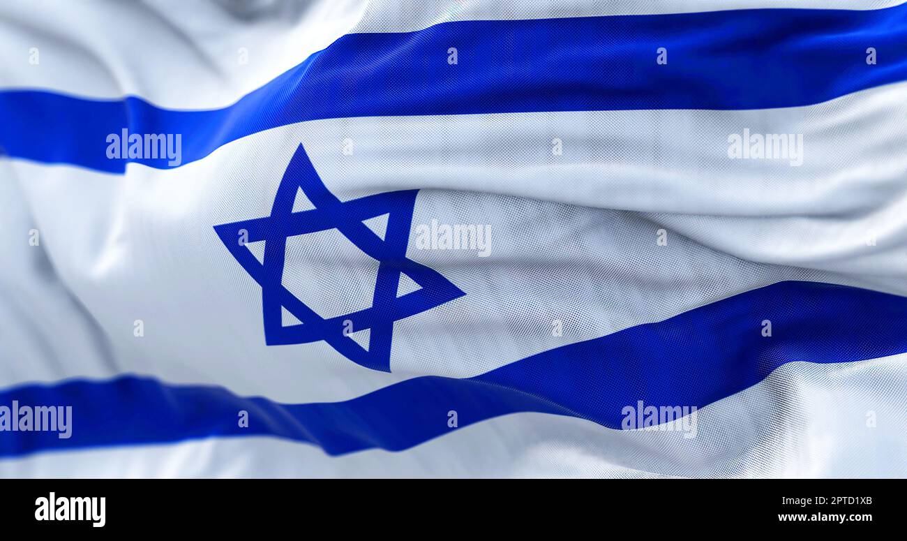 Close-up view of the Israel national flag waving in the wind. The State ...