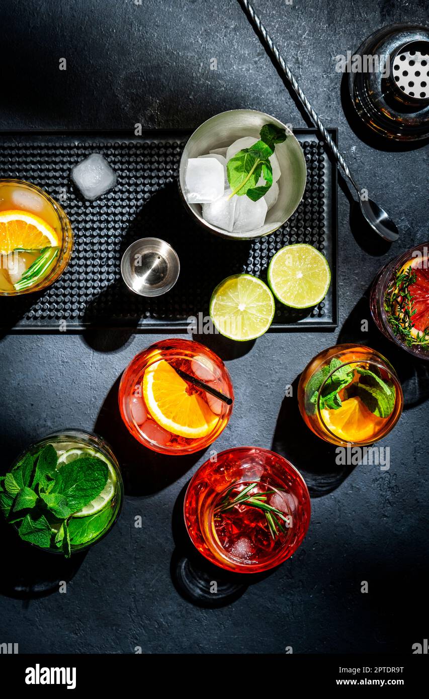 Cocktails set on black bar counter, top view. Mixology concept ...