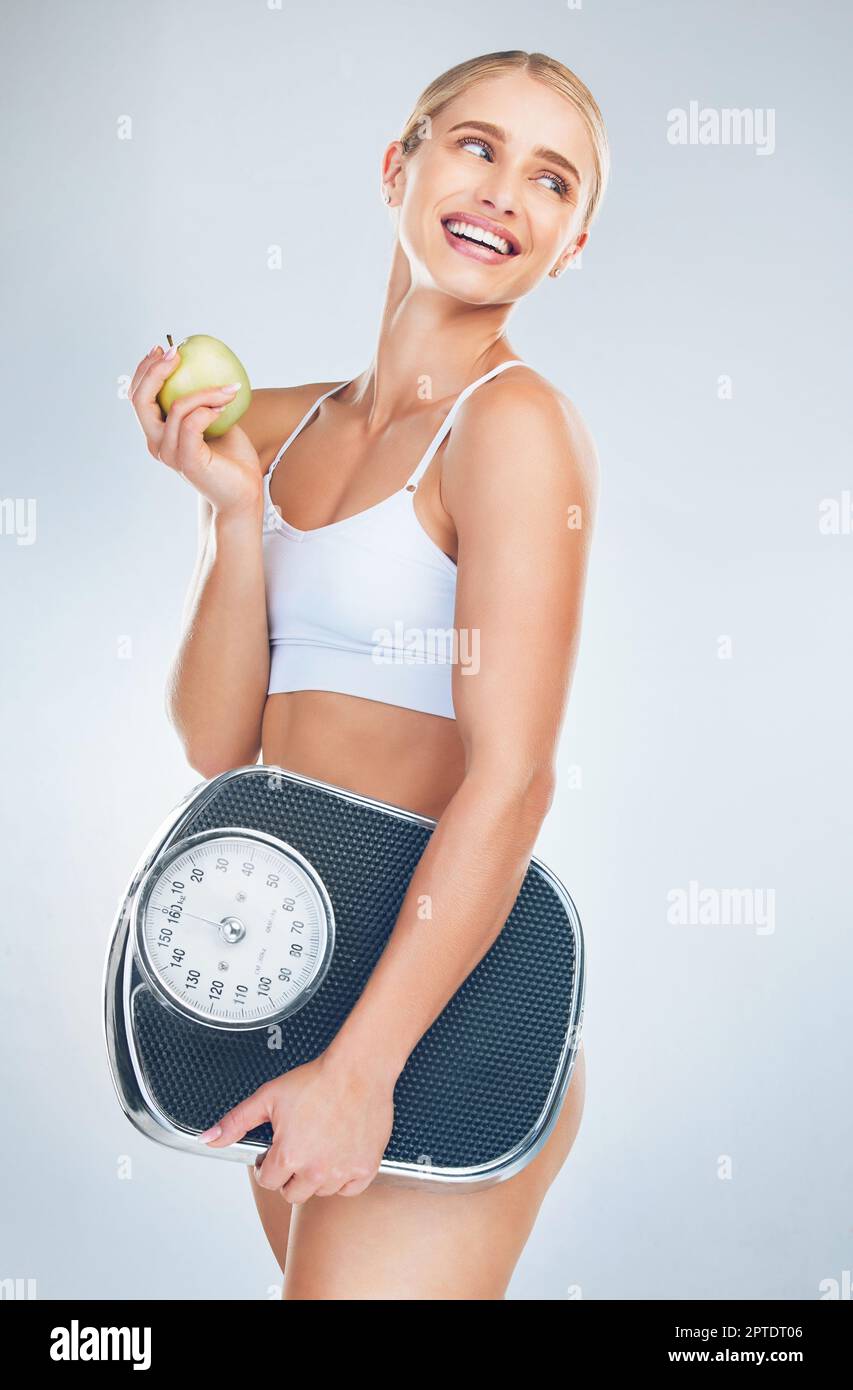 Weight loss, measure tape and wellness of a black woman beauty model with  stomach measurement. Portrait of a woman checking health, diet and healthy  fitness progress feeling happy with a smile