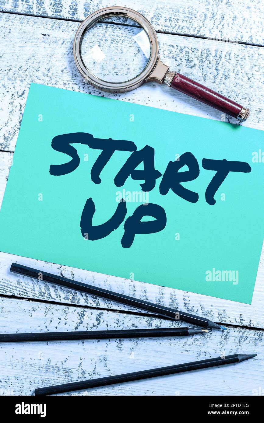 Hand writing sign Start Up, Business concept summarizes the particular ...