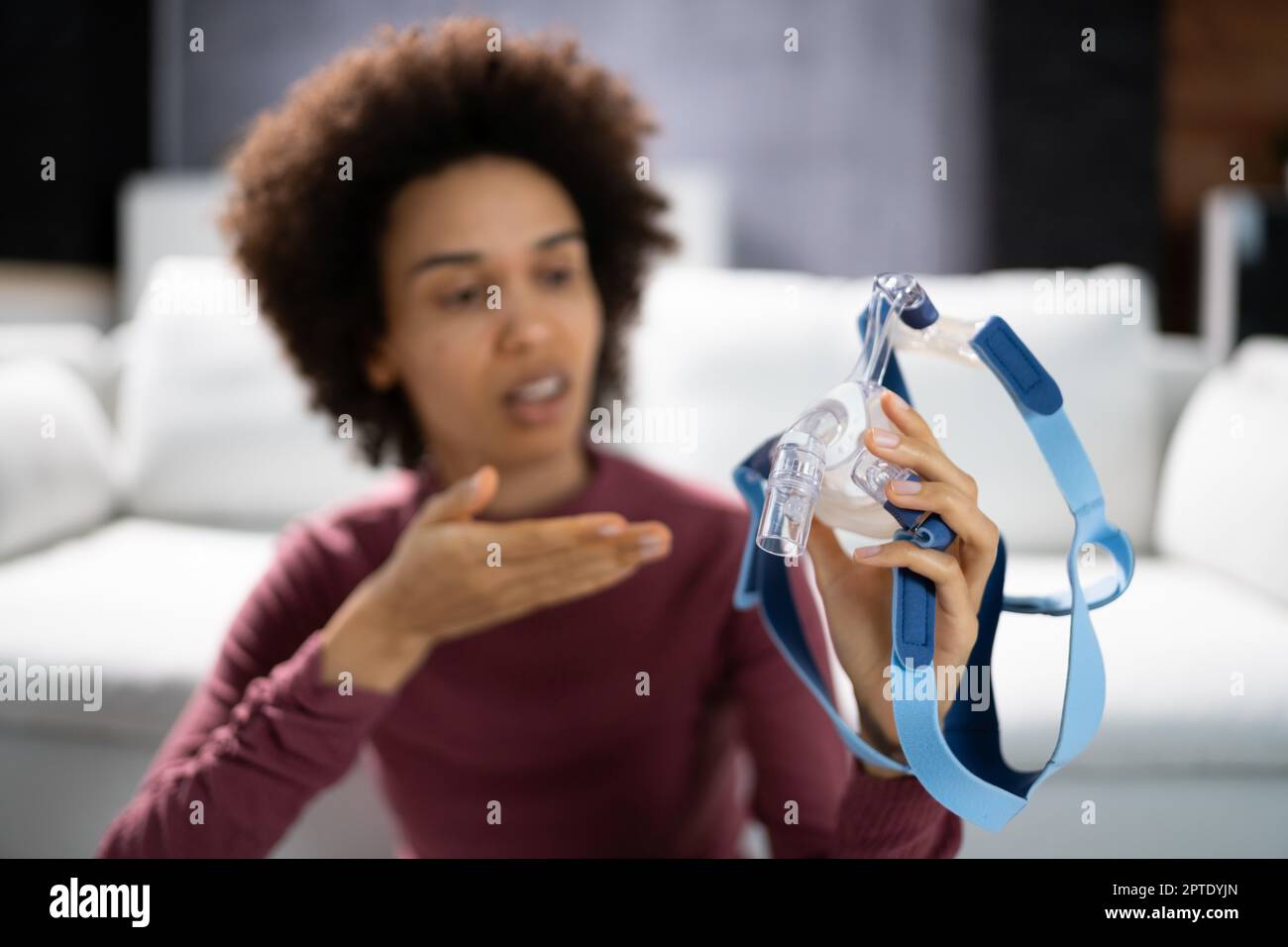 Shocked Young Woman Holding CPAP Machine Mask Stock Photo Alamy