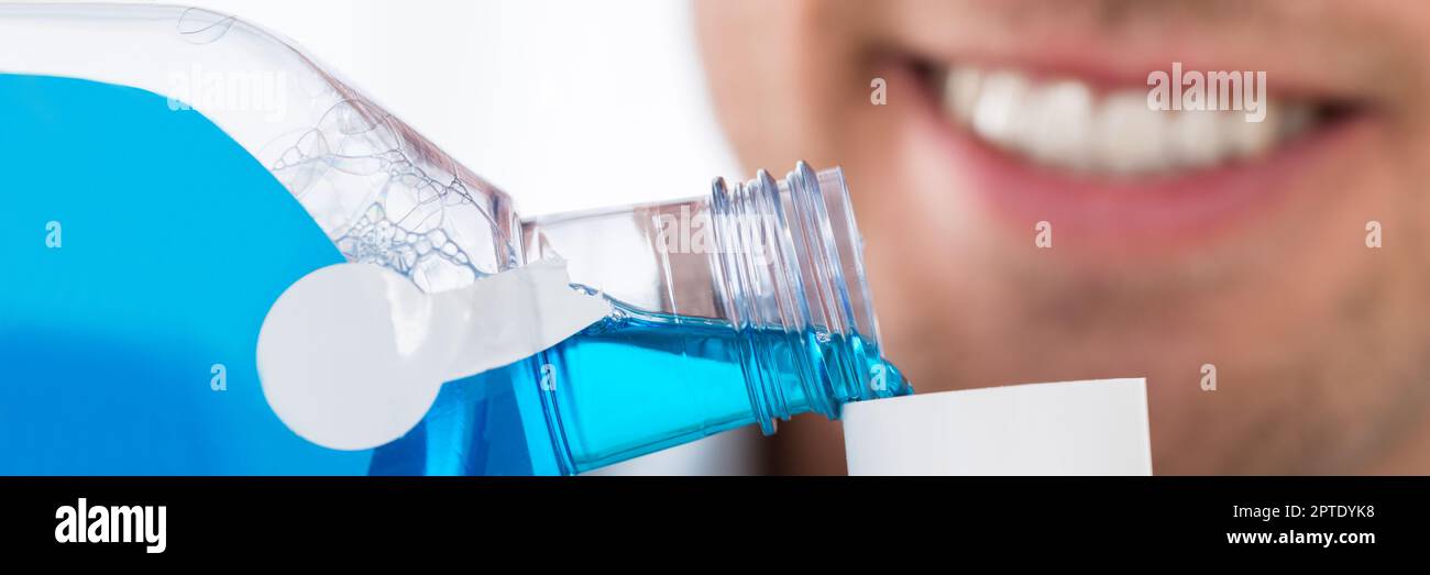 Healthy Mouthwash Rinse. Man Washing Mouth With Antiseptic Liquid Stock Photo Alamy