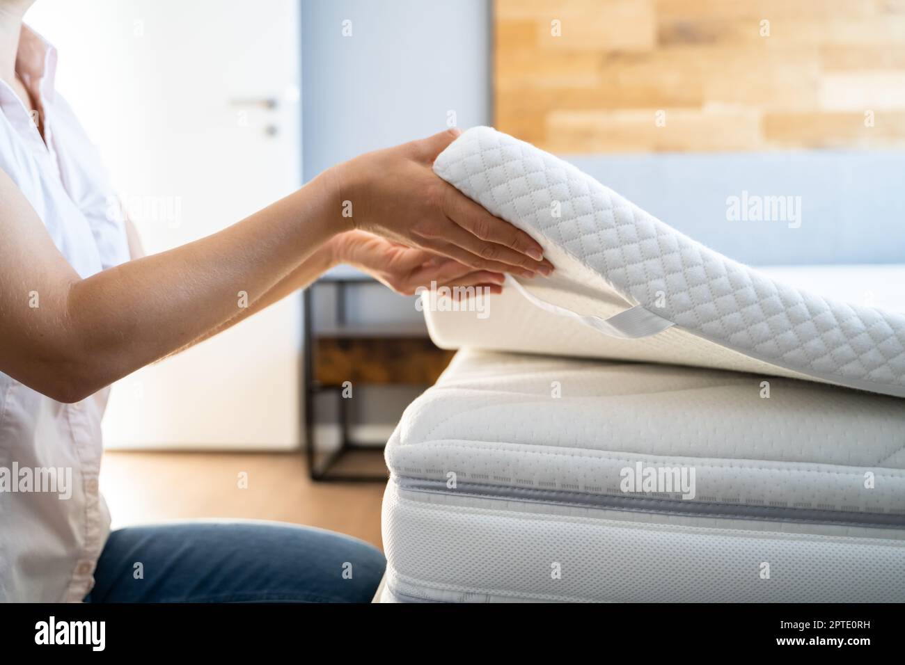 Mattress Topper Being Laid On Top Of The Bed Stock Photo Alamy