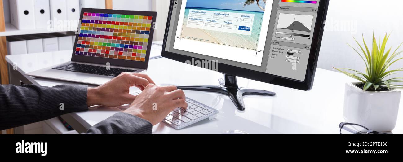 Graphic Web Designer Printing Photo On Computer Stock Photo