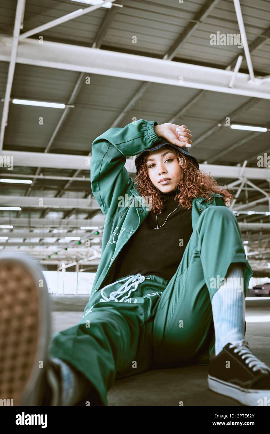 Portrait of black woman, relax and urban fashion, warehouse and modern