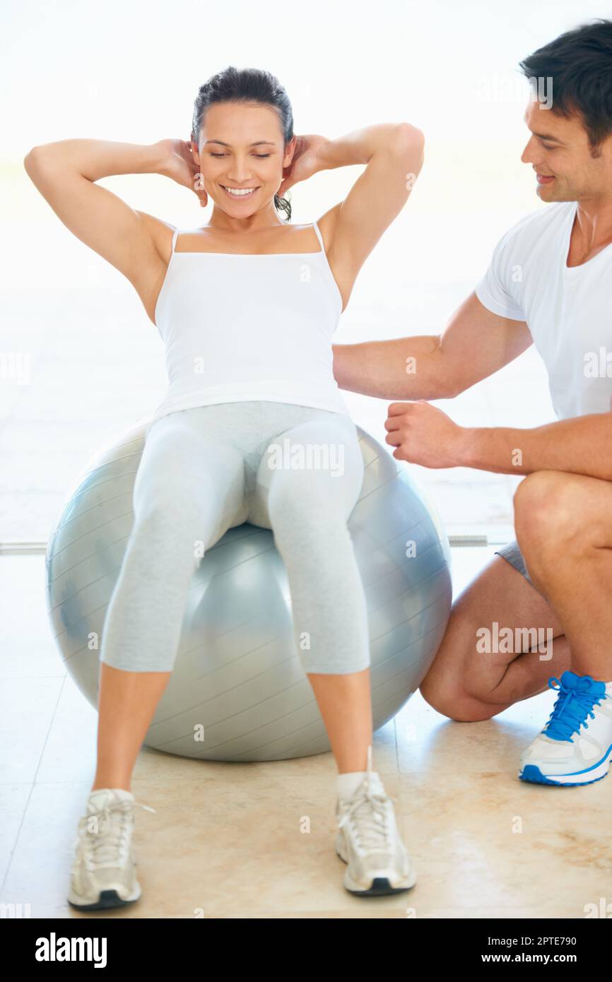 Getting back to the basics of fitness. A fitness instructor showing a ...
