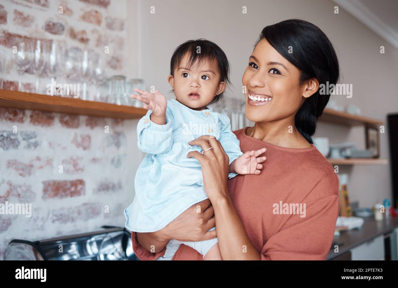 Disability, mother and baby with down syndrome in a happy and lovely