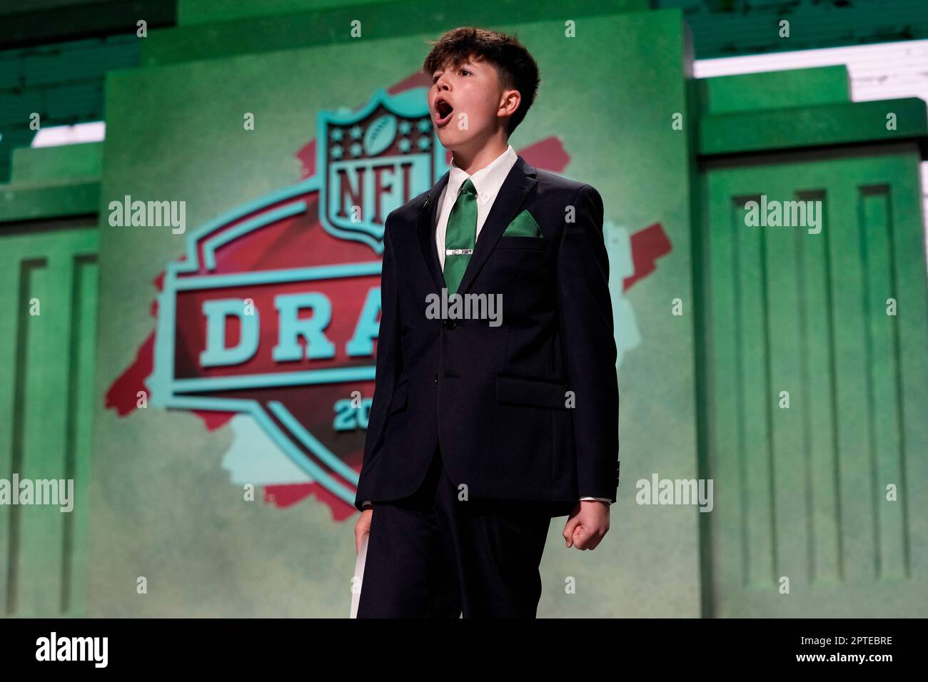 Cancer survivor Kyle Stickles, who is a MakeAWish kid, walks onstage