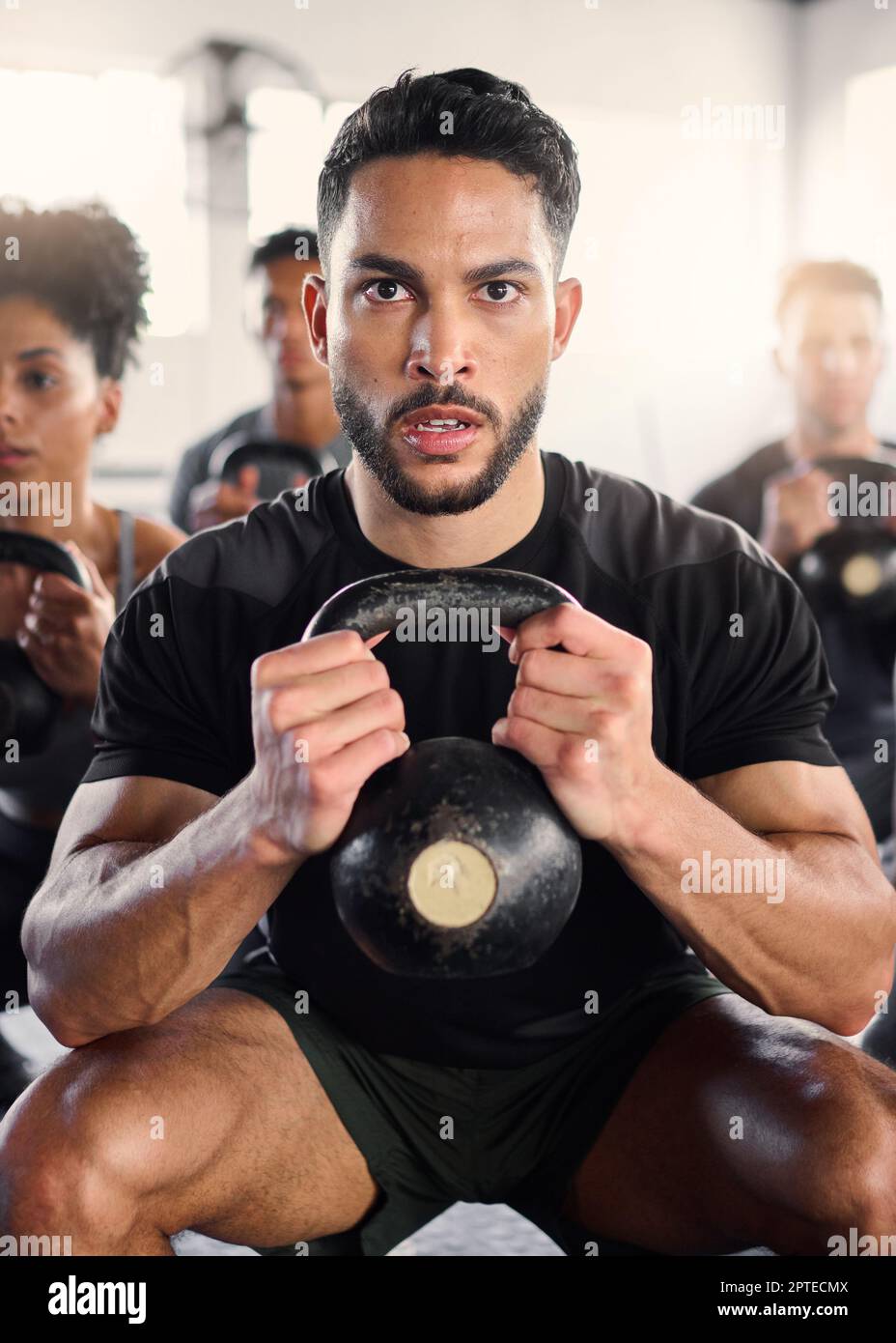 Gym class, people and kettlebell workout with personal trainer for