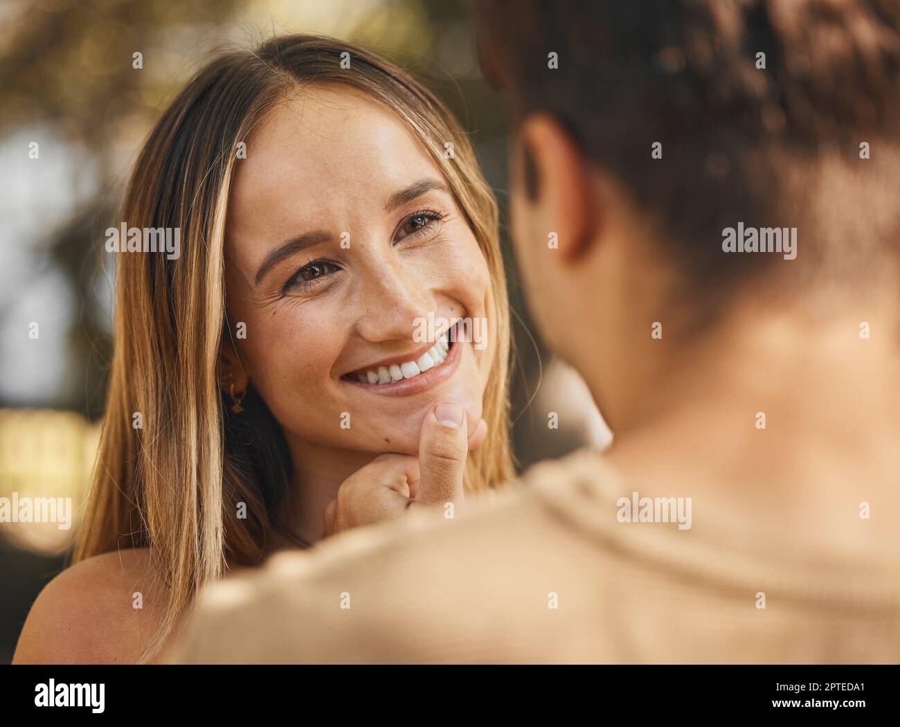 Woman touching boyfriend face hi-res stock photography and images - Alamy