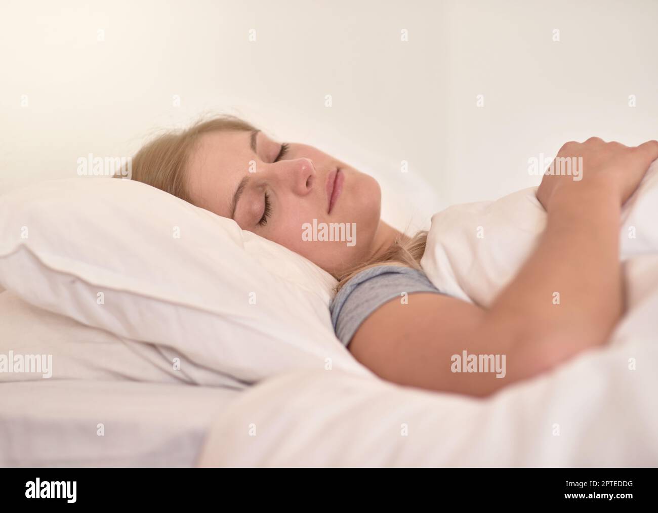 Sleep solves everything. a young woman sleeping peacefully in her bed