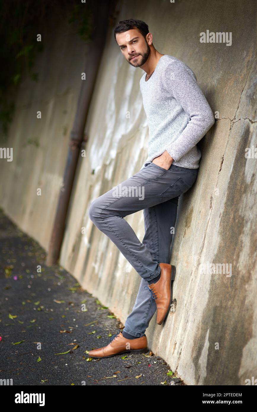 style isnt just found on the runway a handsome young man posing against an urban wall 2PTEDEM