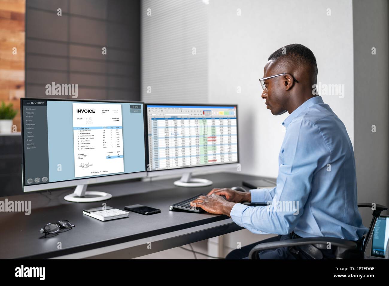 African American Accountant Using Electronic Invoice Software Stock Photo