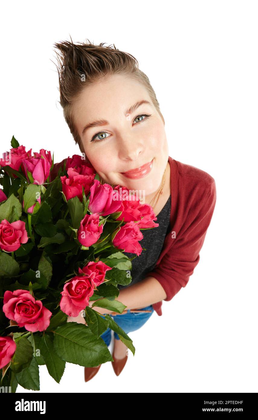 Beautiful roses and theyre all for me. Studio portrait of a happy young