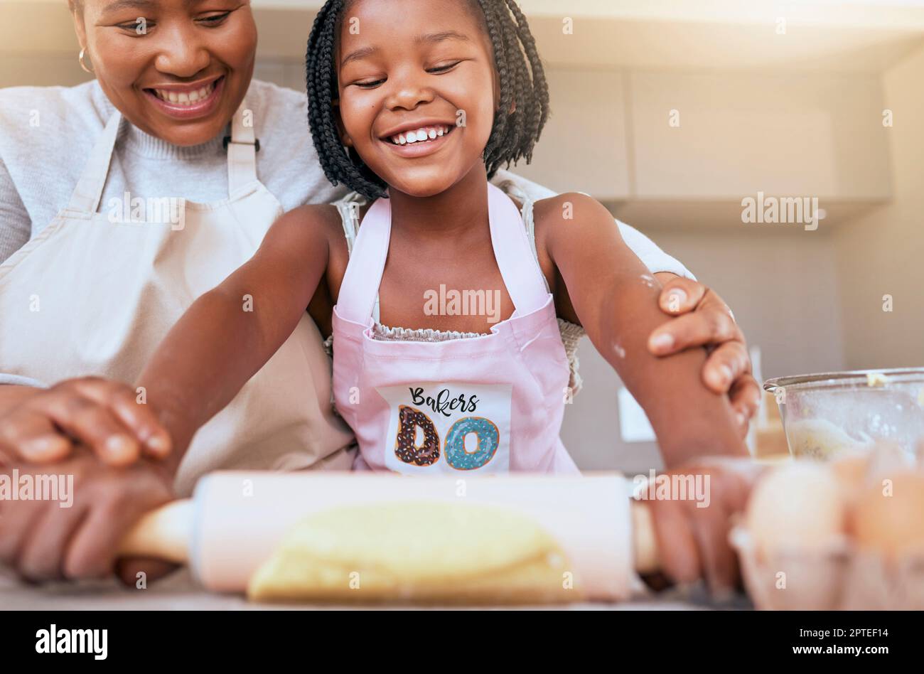 Baking, mother and child helping in the kitchen, learning and smile for