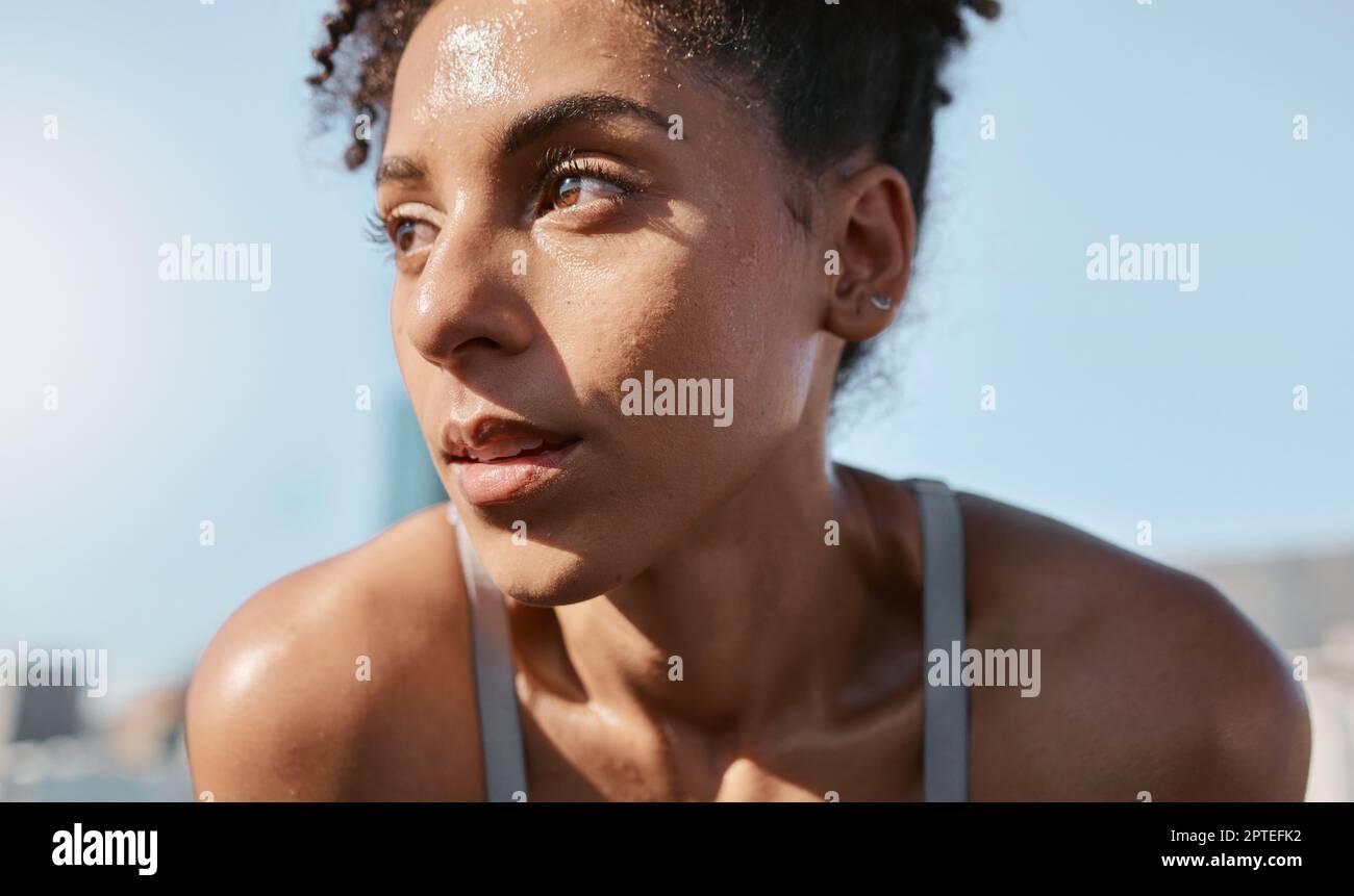 Face, sweat and fitness with a sports black woman tired after a cardio