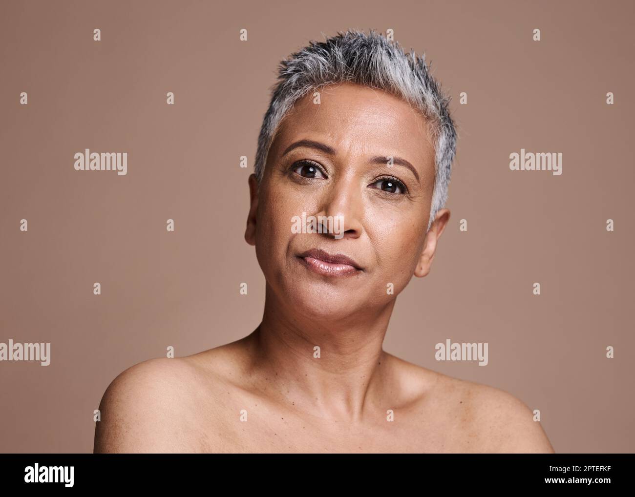 Stuido Portrait Of Serious Senior Woman Stock Photo, Picture and