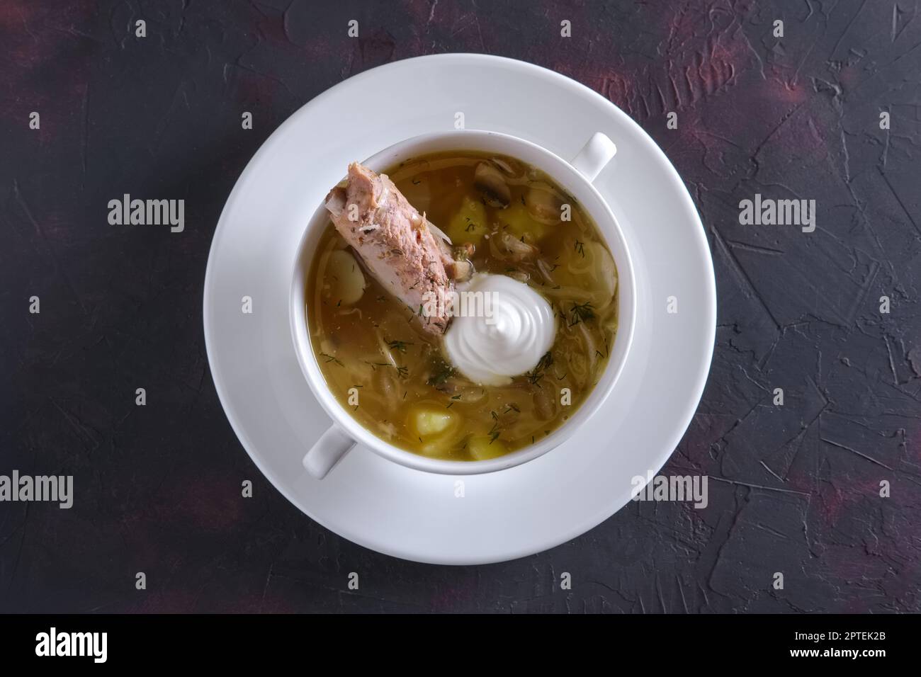Beef bouillon with meat on a bone Stock Photo Alamy