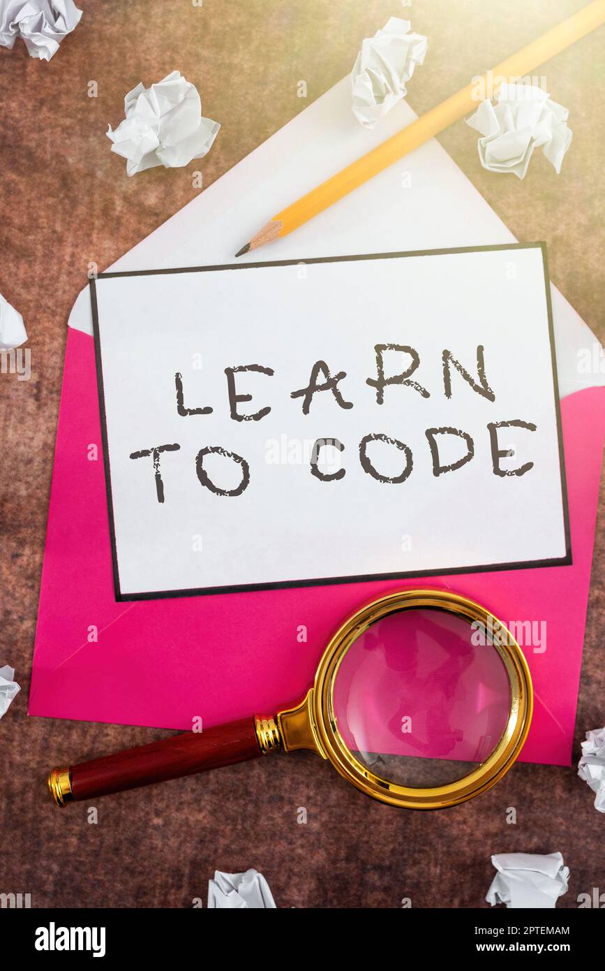 Writing displaying text Learn To Code, Internet Concept Learn to write Software Be a Computer Programmer Coder Stock Photo
