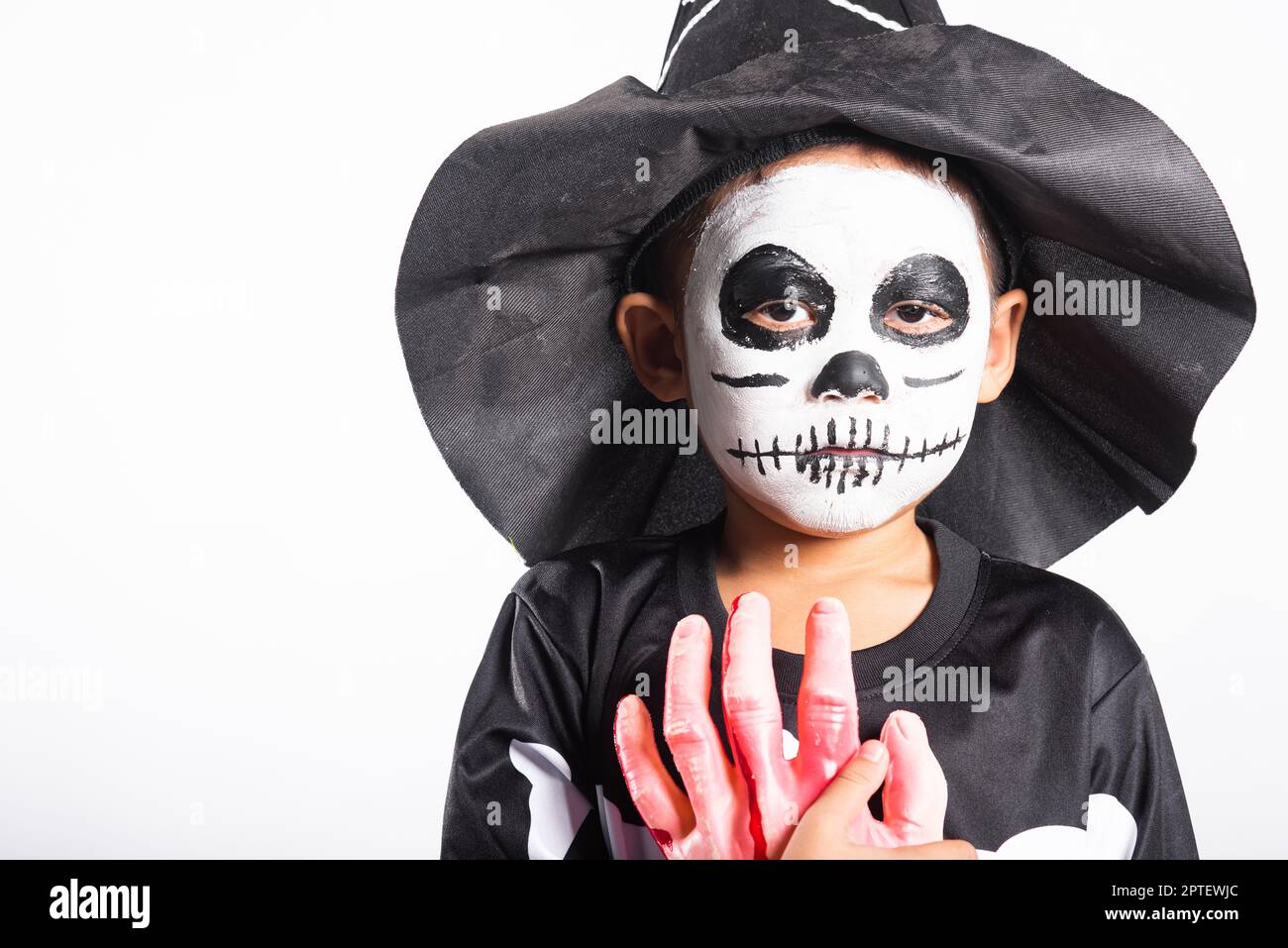 Halloween Kid. Portrait of Asian little kid boy wearing skeleton ...