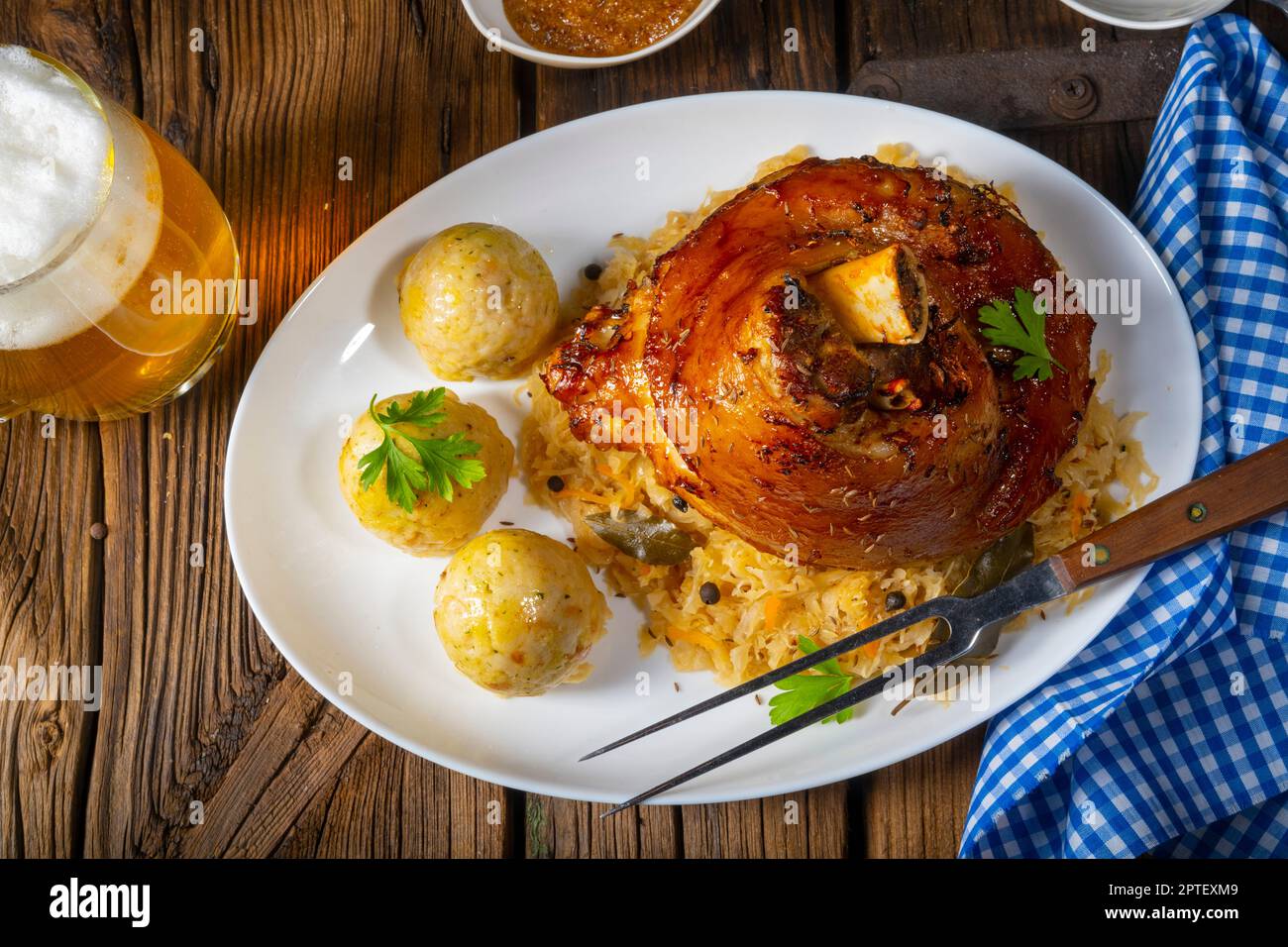 pork knuckle with sauerkraut and sweet mustard Stock Photo Alamy