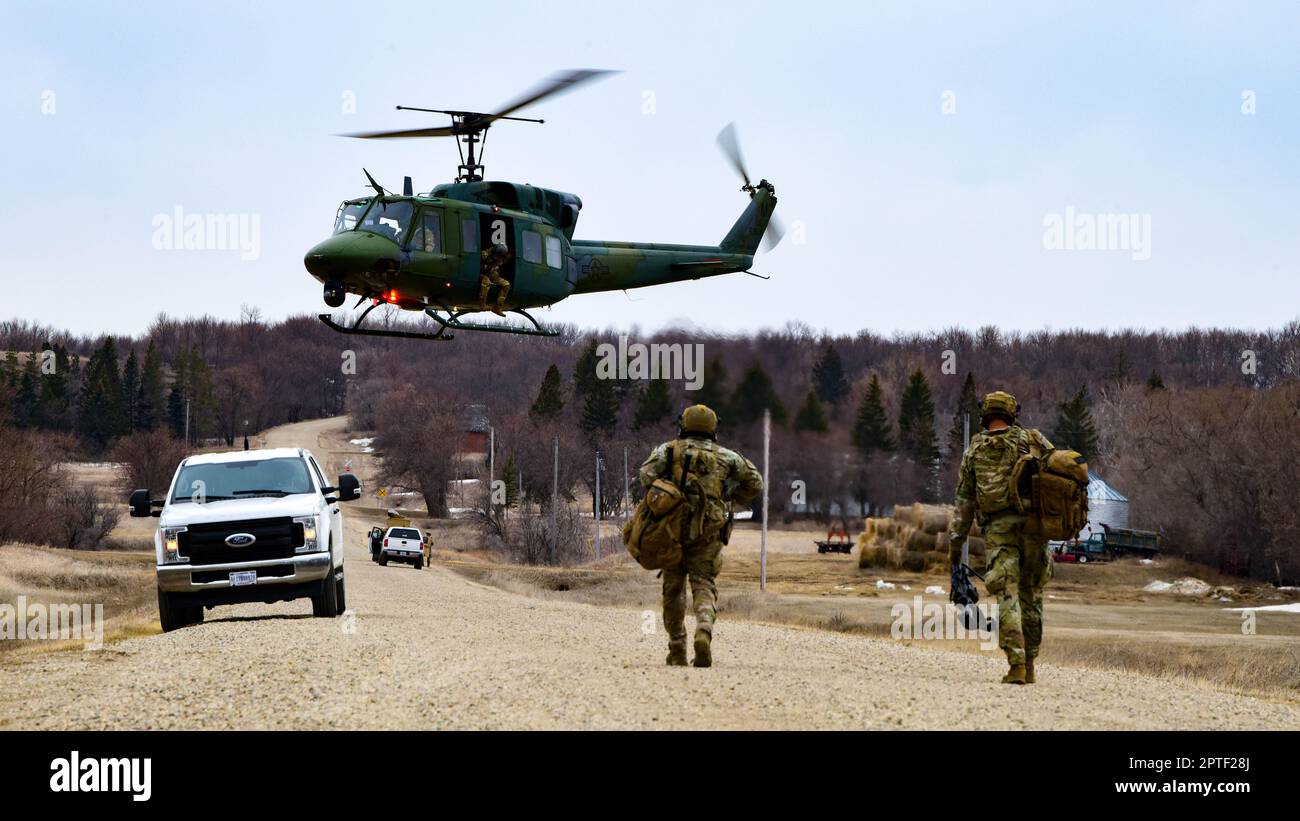U.S. Airmen assigned to the 91st Missile Security Operations Squadron Tactical Response Force prepare to board a UH N1 helicopter after a recapture and recovery exercise in support of Global Thunder 2...