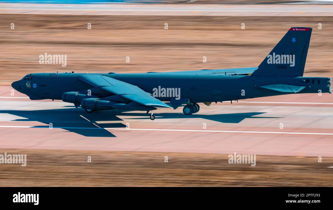 A U.S. Air Force B-52H Stratofortress assigned to the 2nd Bomb Wing prepares to take off during Global Thunder 23 (GT23) at Minot Air Force Base, North Dakota, April 16, 2023. The U.S. military’s strategic deterrence includes a triad of nuclear delivery platforms and associated tankers; an intelligence and sensing apparatus to give indications and warnings of incoming threats; assured national and nuclear command, control and communications; the necessary infrastructure to sustain and maintain reliable warheads; a credible missile defense system that defends against limited attacks; a resilien Stock Photo