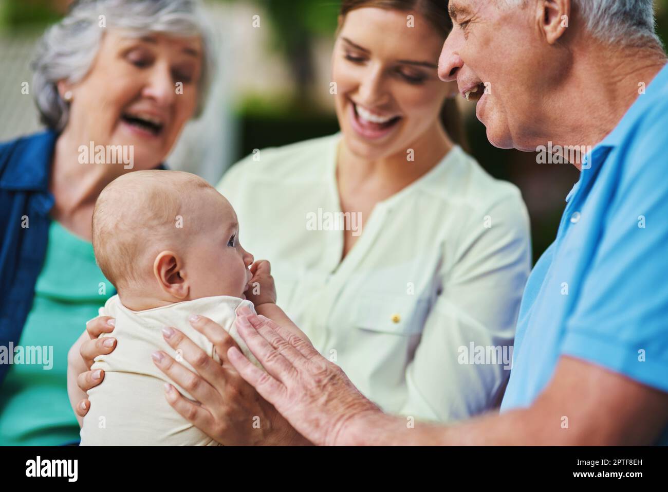 Our time together is never enough. a three generational family spending time outdoors Stock Photo