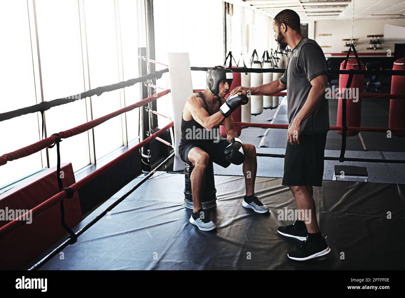 The best coaches bring out the best in their boxers. a man training in