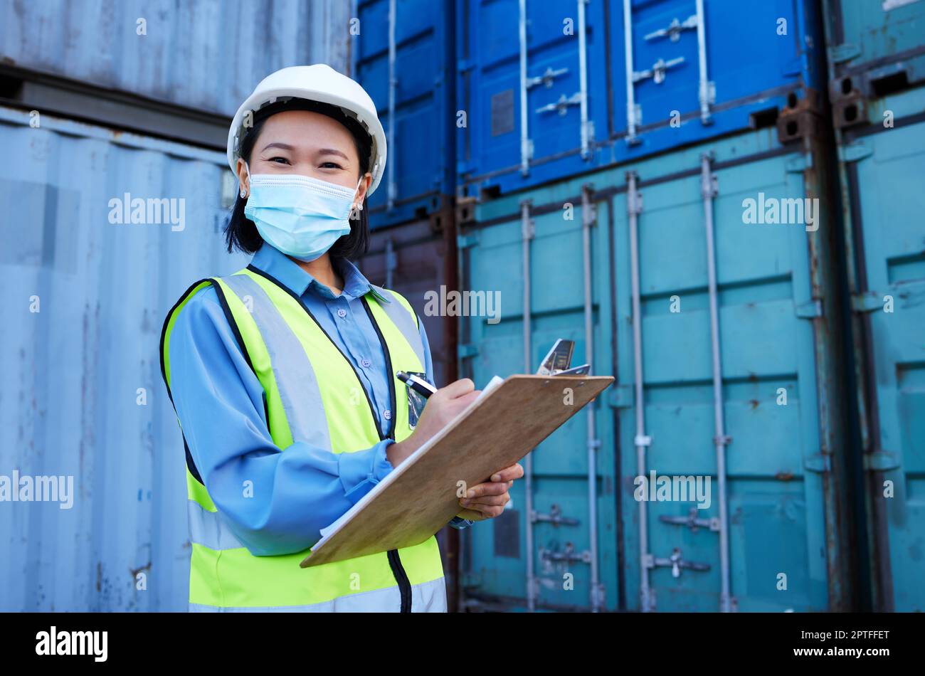 Container, covid 19 and engineer woman checklist planning cargo distribution, shipping and manufacturing logistics. Supply chain Asian manager or cont Stock Photo