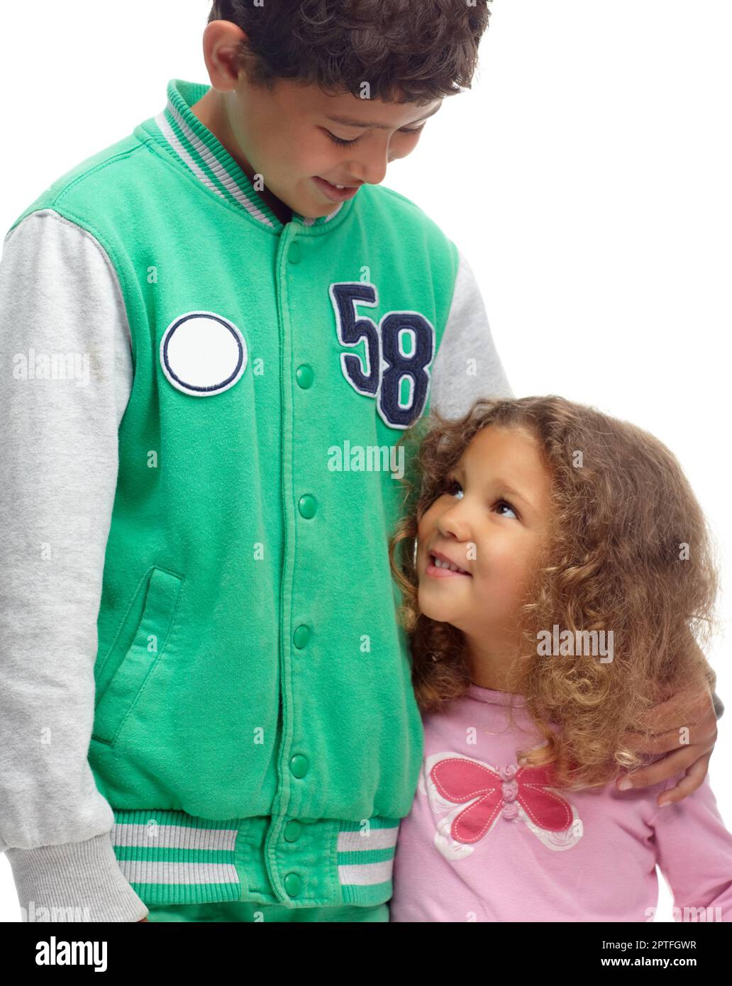 Hes her big brother. Cute siblings standing together and smiling Stock Photo