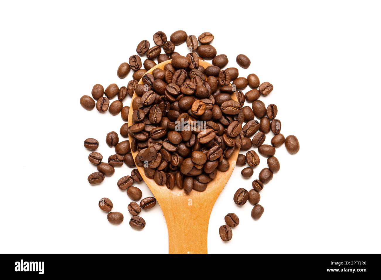 Wooden spoon with coffee beans on white background Stock Photo - Alamy
