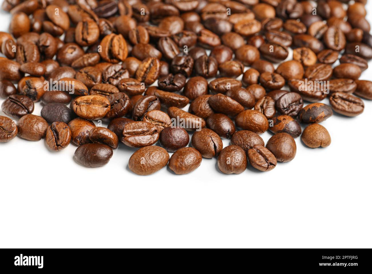 Heap of coffee beans isolated on white background Stock Photo - Alamy
