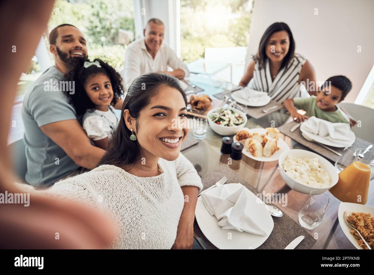 Big family selfie while eating food or lunch together in their home