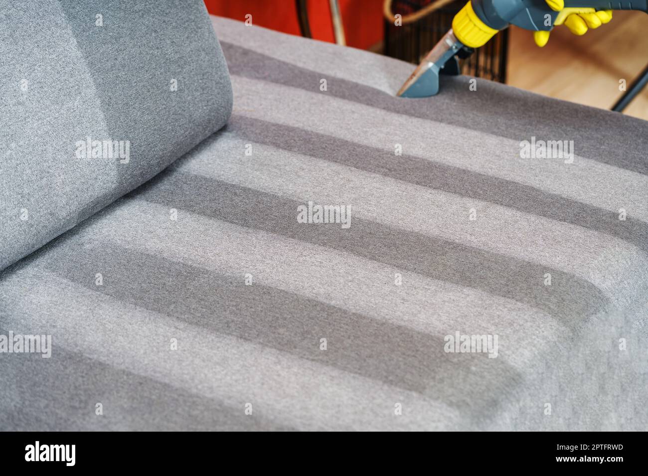 Sofa before and after wet cleaning indoors. textile sofa vacuum