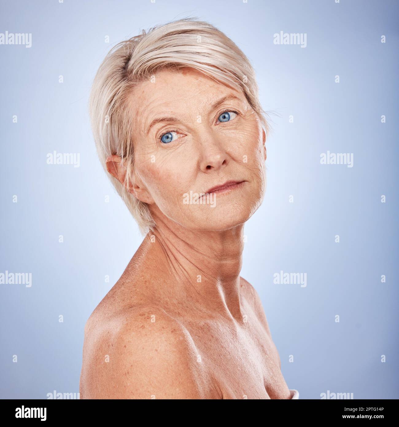 Beauty, skincare and mature woman with healthy, glowing skin on a grey