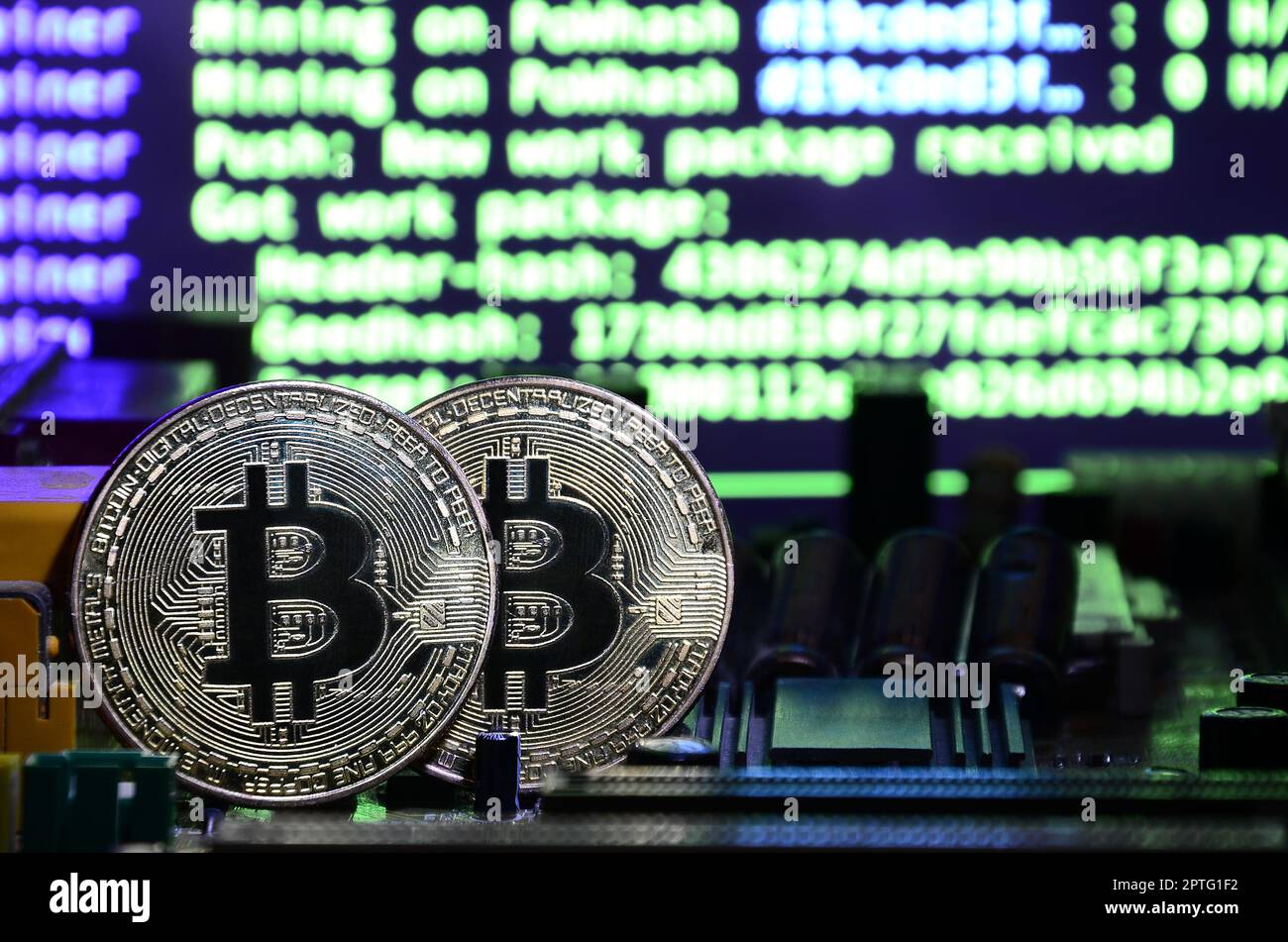 The digital process of cryptocurrency mining by using the GPUs. Bitcoins  and video card on a working display and mining screen Stock Photo - Alamy