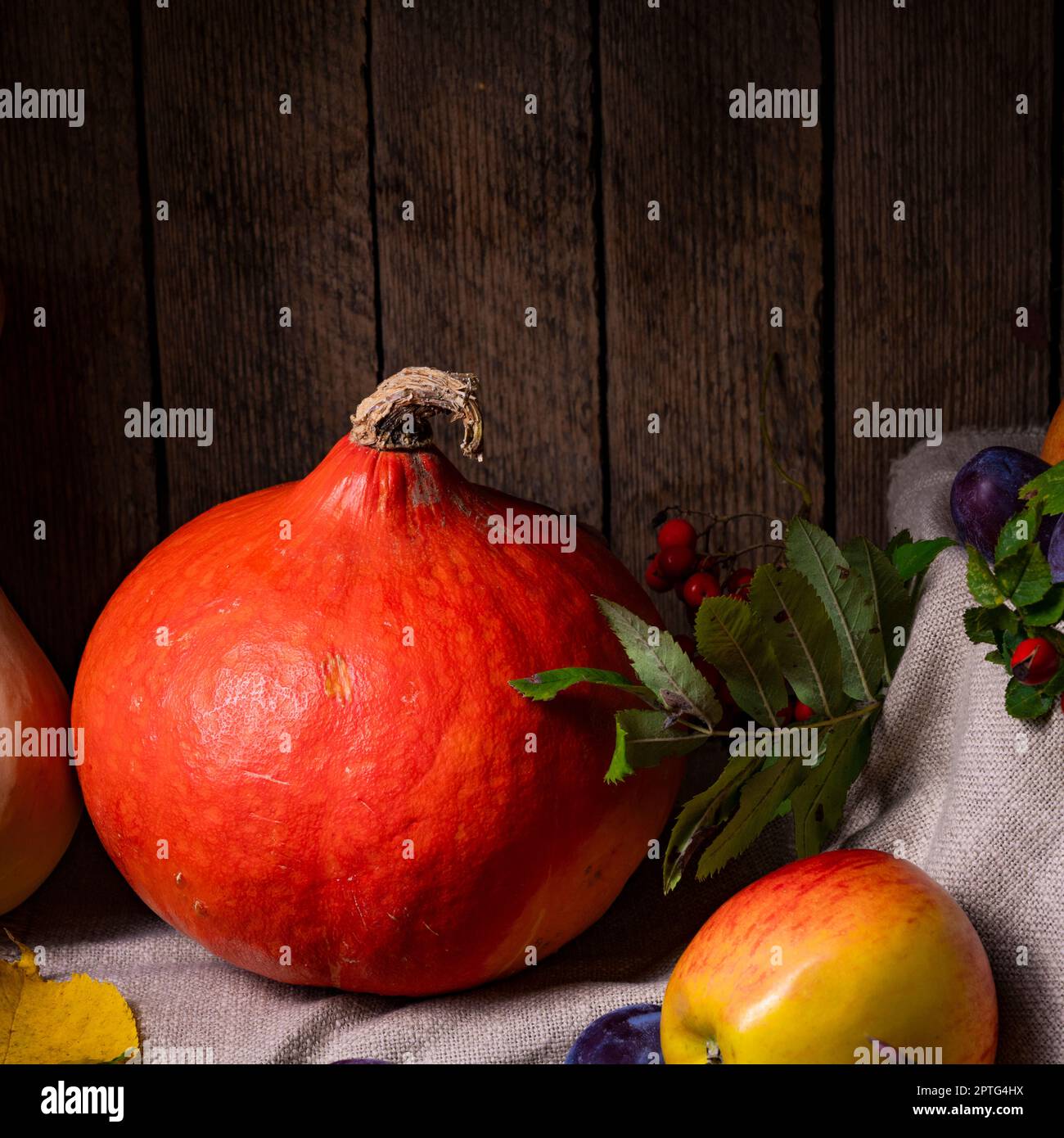 Various fruits in a wooden box with autumn leaves Stock Photo - Alamy