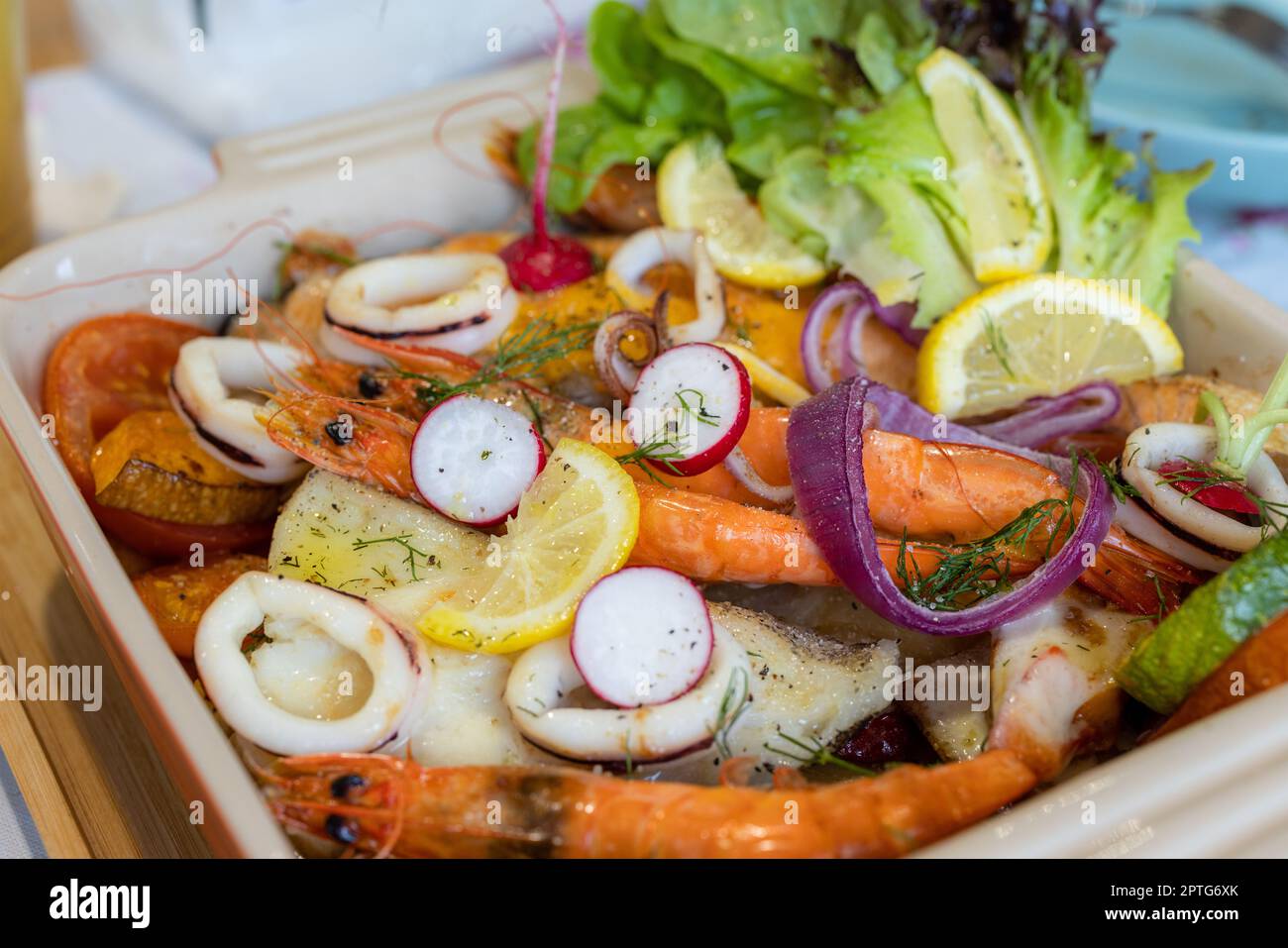 Roasted seafood and dishes in restaurant Stock Photo - Alamy