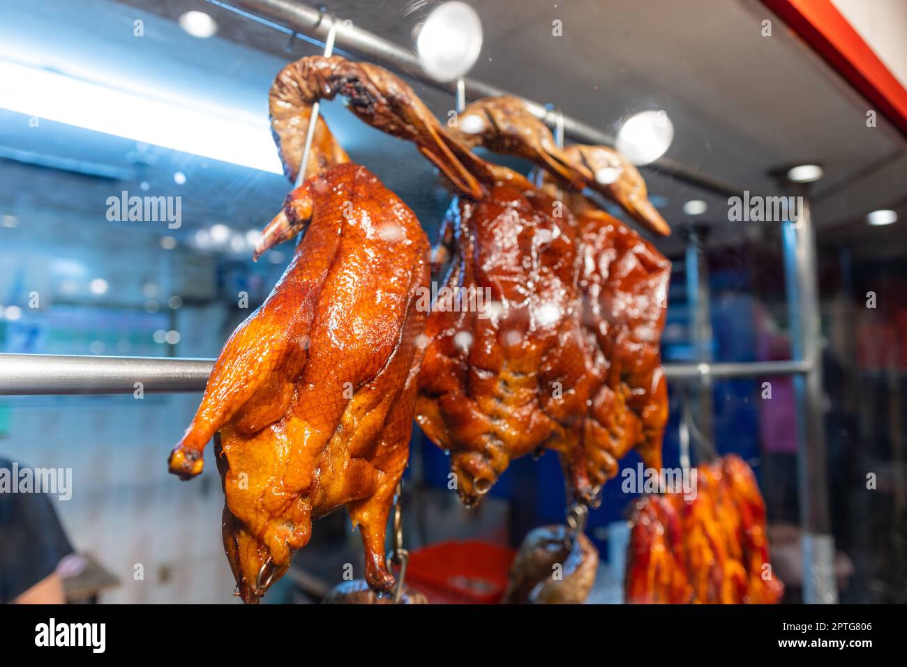 Chinese restaurant traditional gourmet roast goose hanging up in the