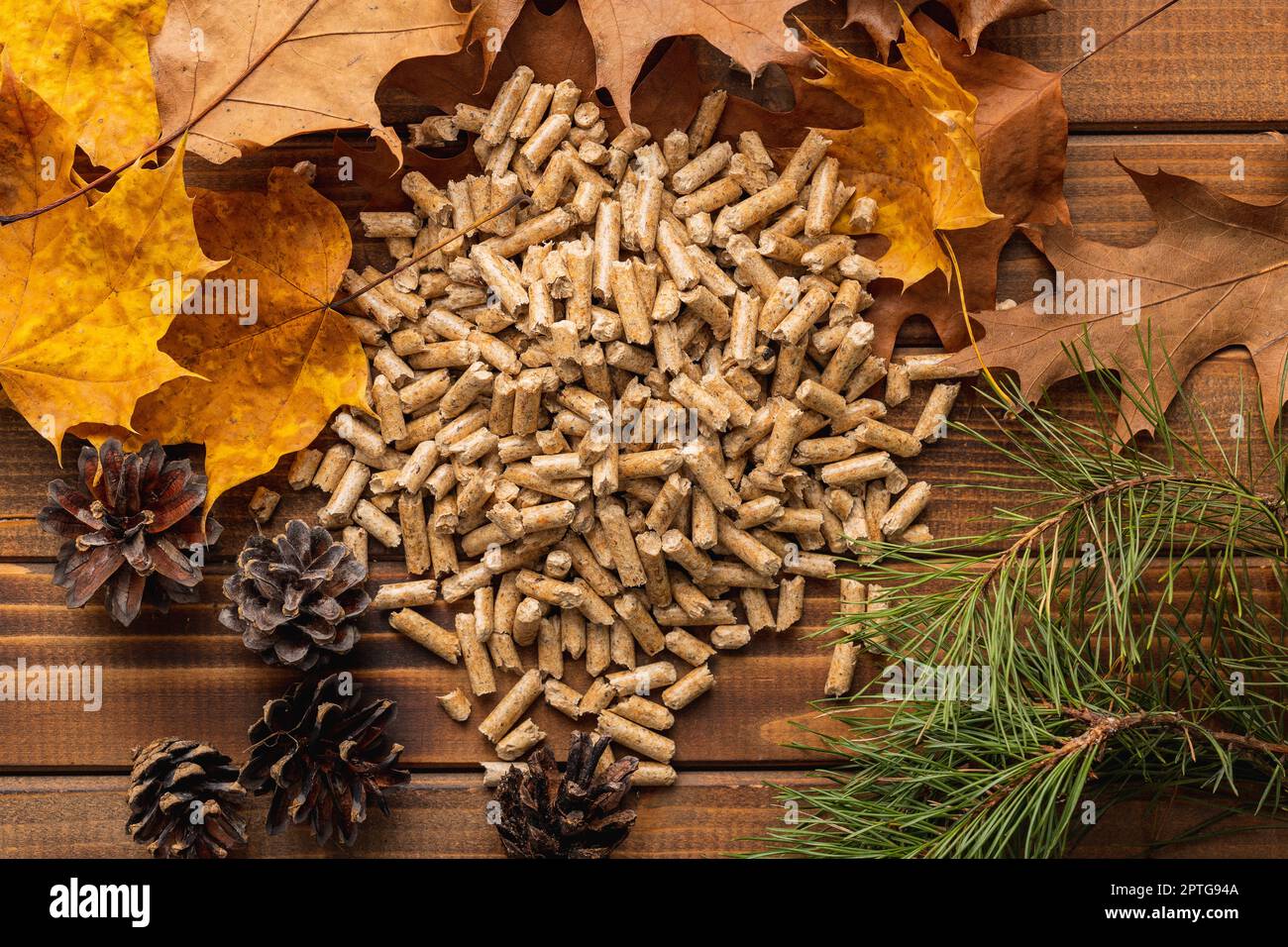 Wooden pellets on the wooden table. Top view. Stock Photo