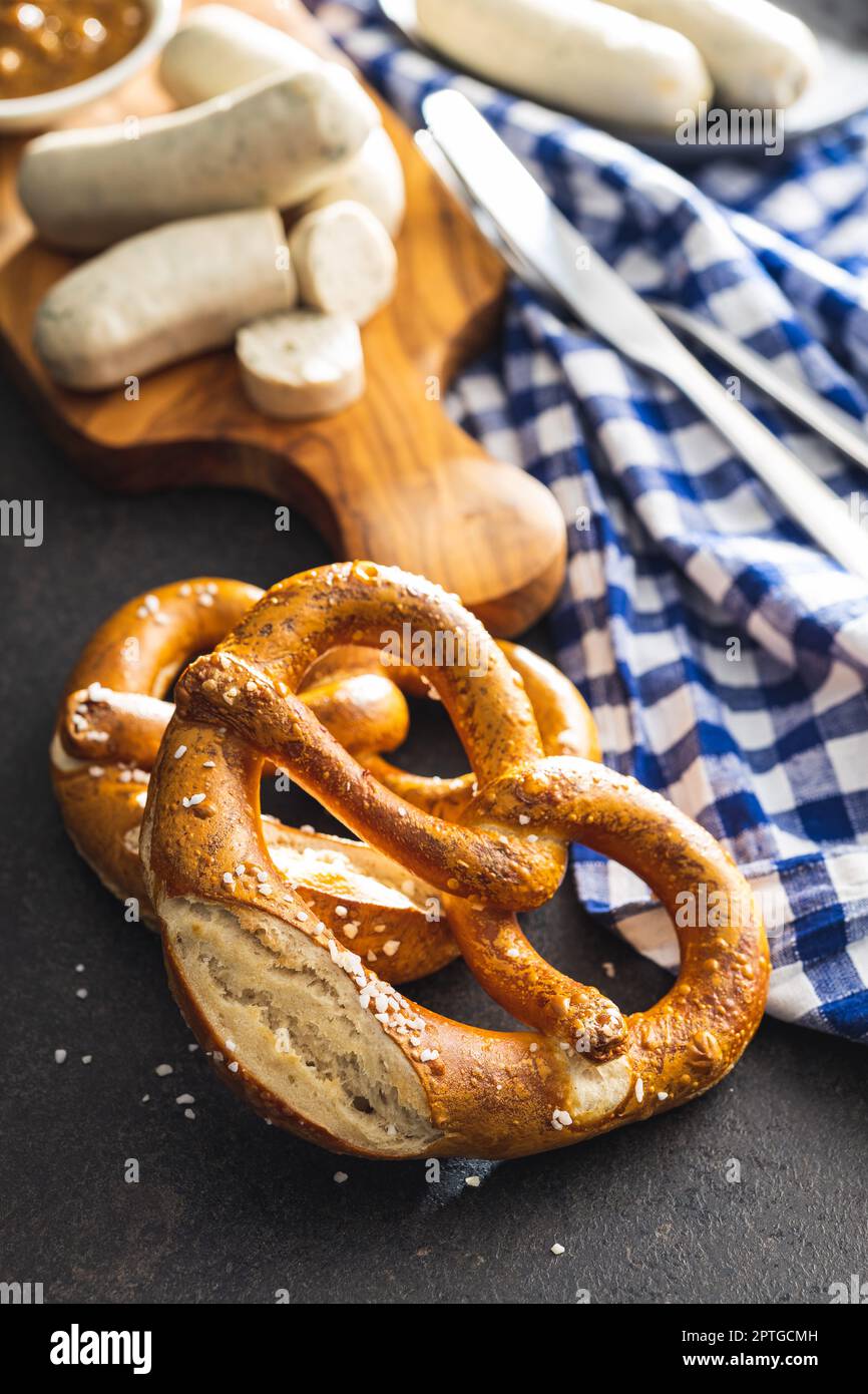 Baked bavarian pretzels on the black table. Stock Photo