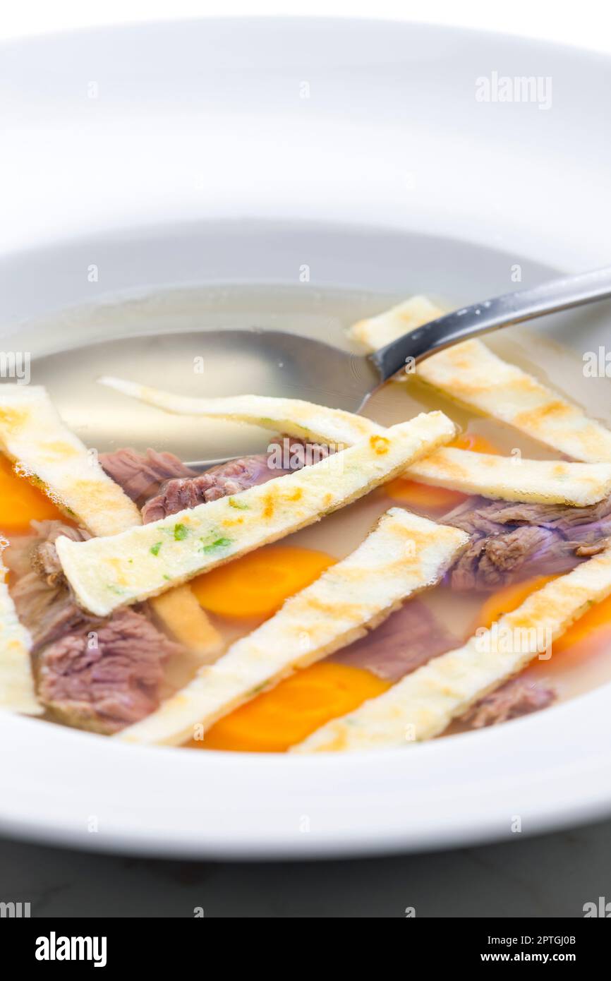 beef soup with celestine noodles and carrot Stock Photo Alamy