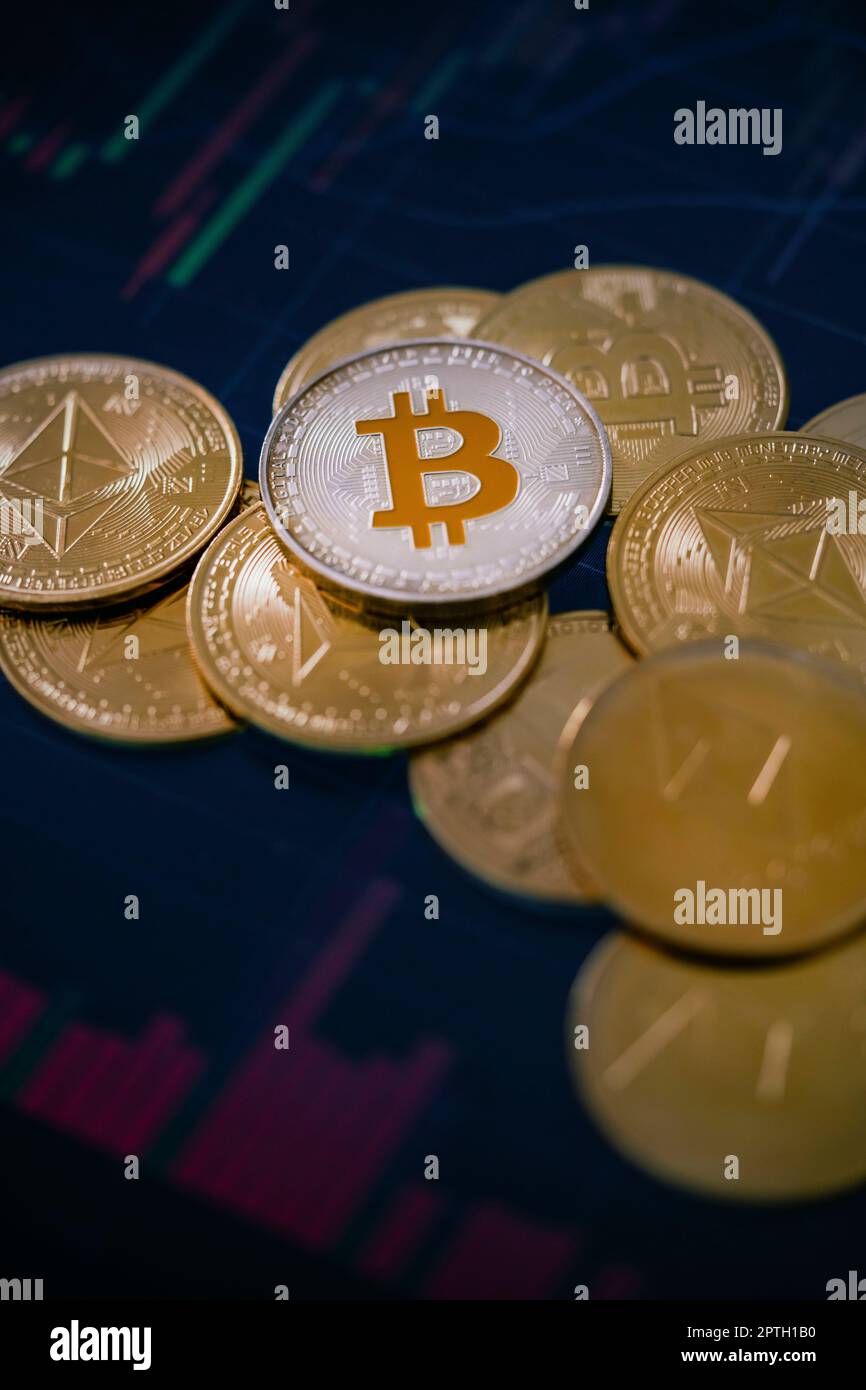 Stack or heap of gold various cryptocurrency coins with candle stick ...