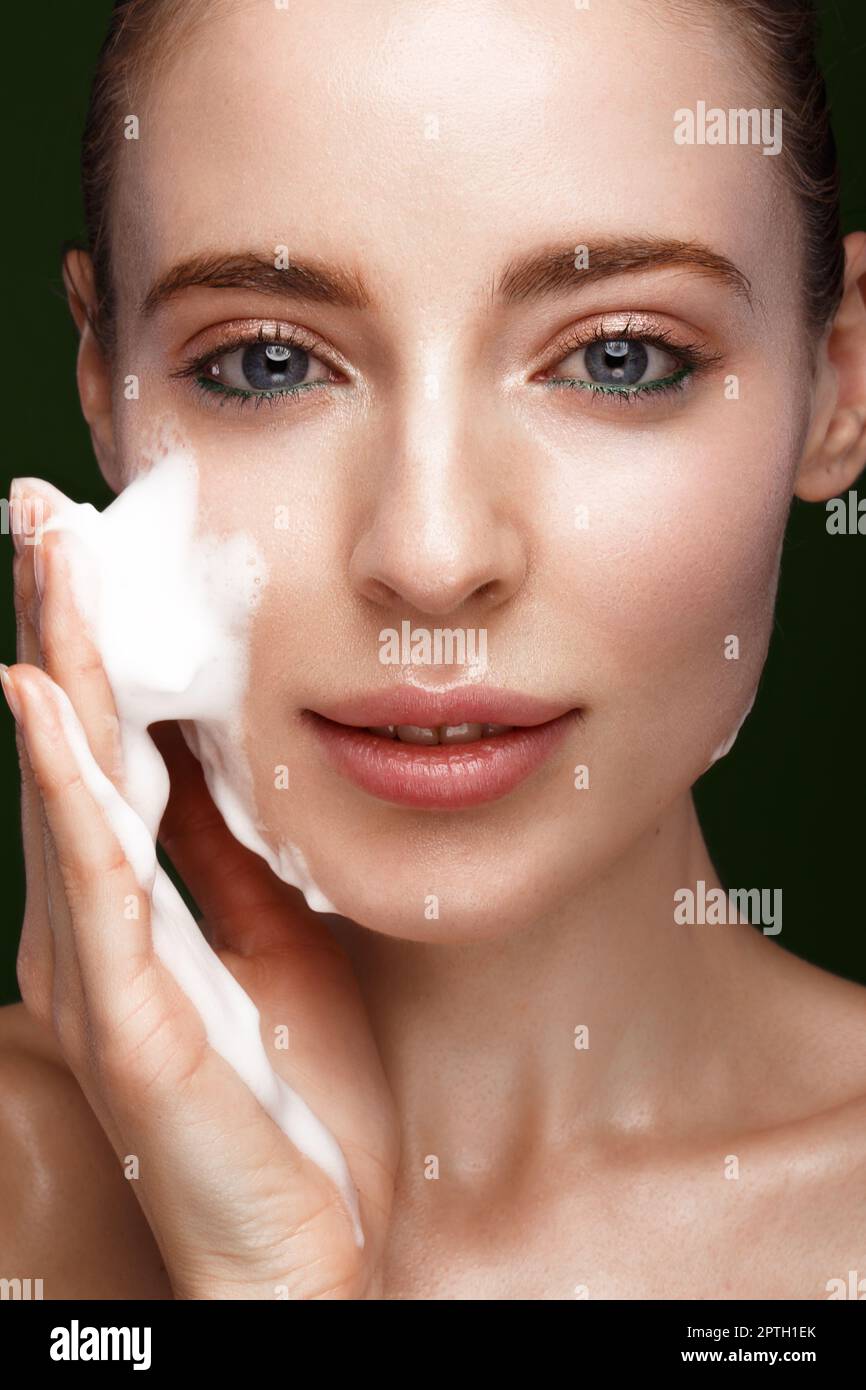 Beautiful young girl with facial wash on the skin. Beauty face. Picture
