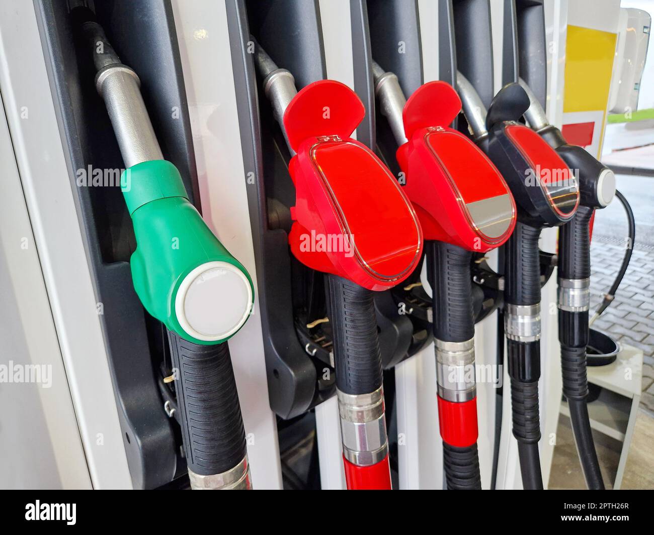 Closeup of a refueling stand with refueling guns at gas station Stock ...