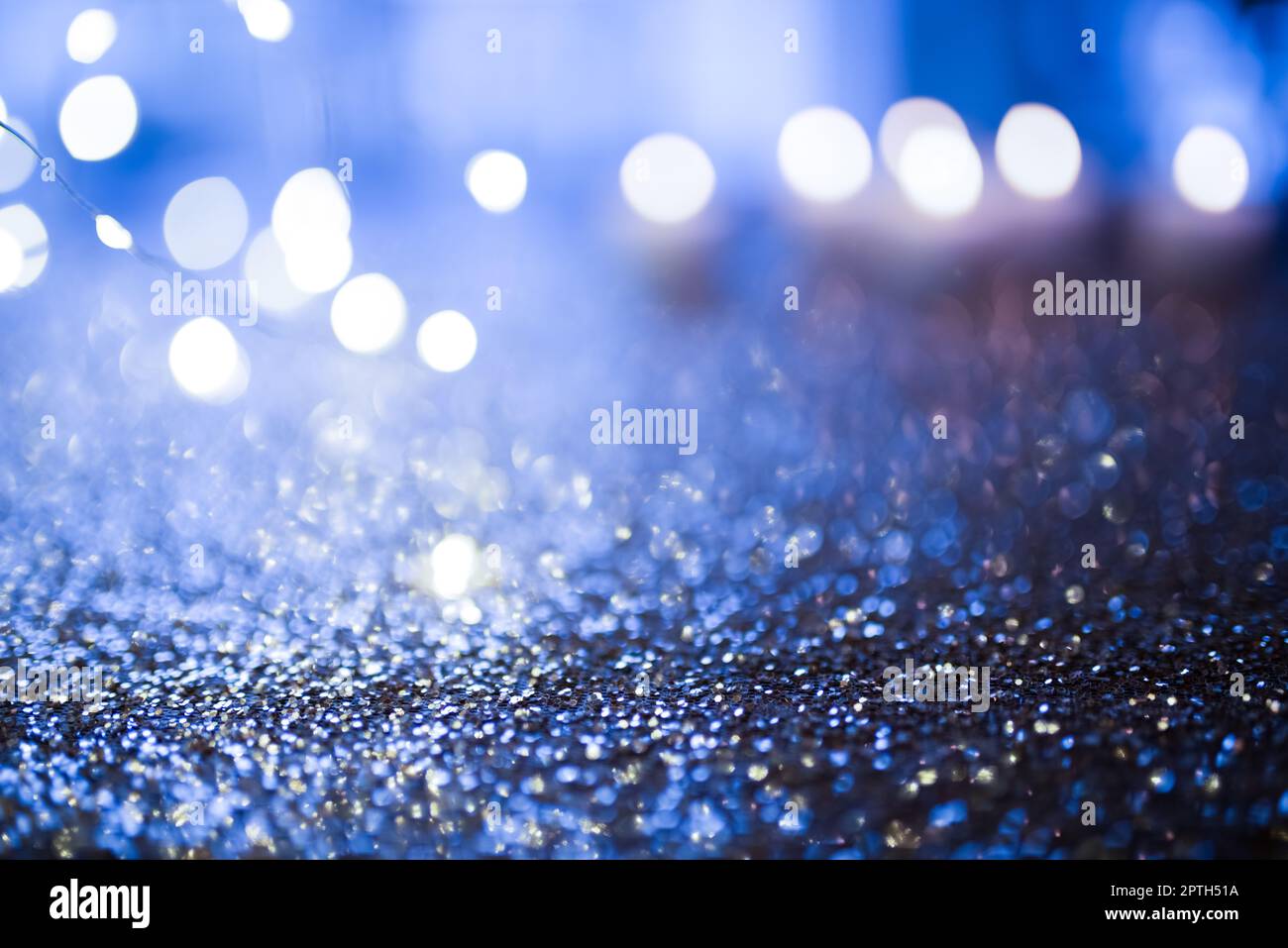 Abstract blue glitter background with bokeh lights. Banner for shiny ...