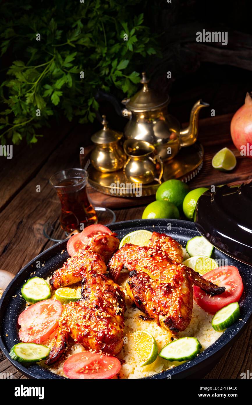 couscous with fried chicken wings spicy Stock Photo Alamy