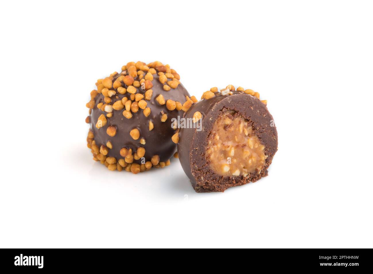 Chocolate caramel ball candies with almonds isolated on white